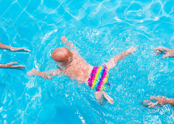 image shows a baby swimming