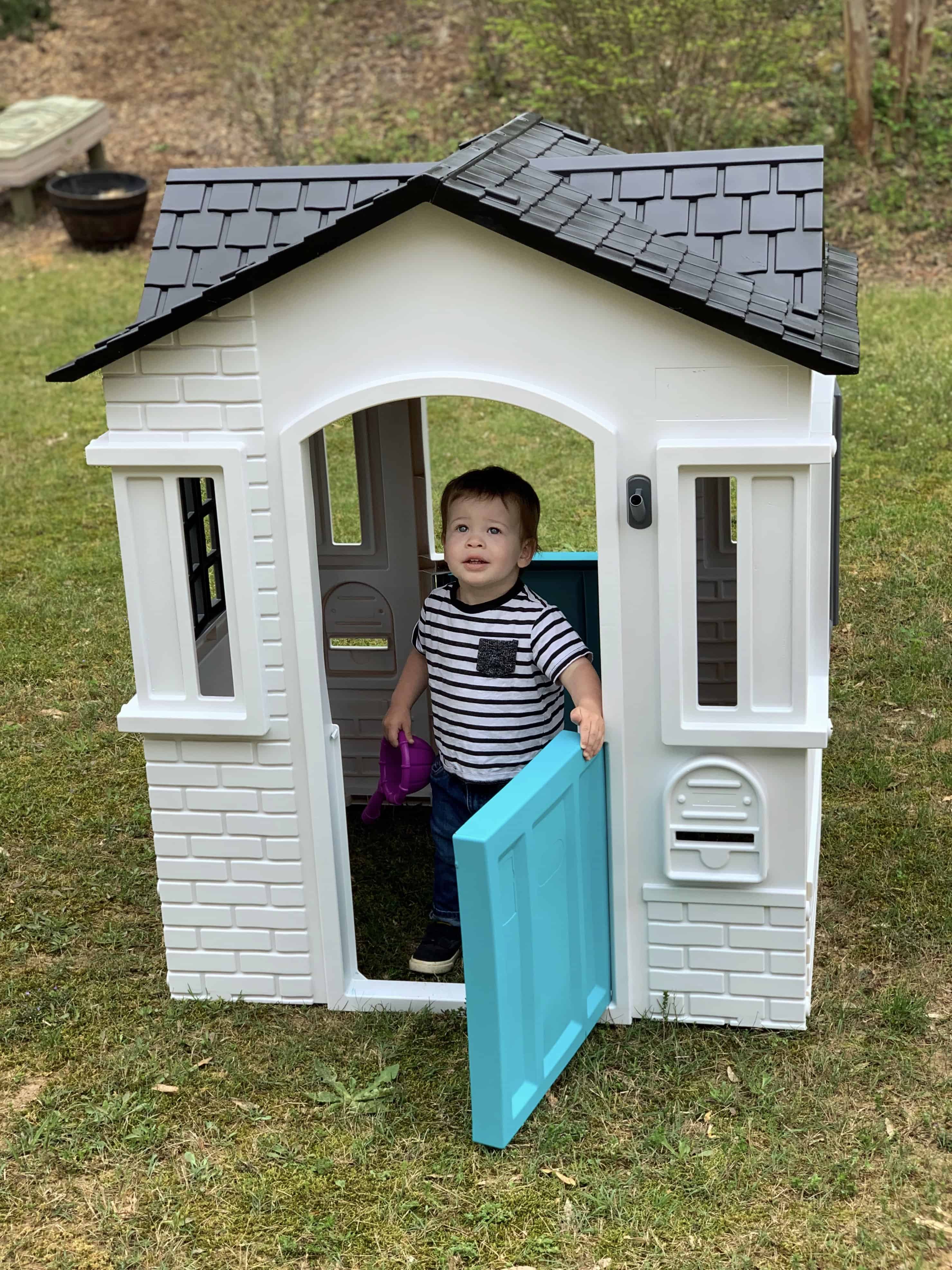 DIY Plastic Playhouse Makeover- little boy playing in house