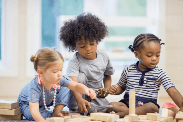 shows three young children playing