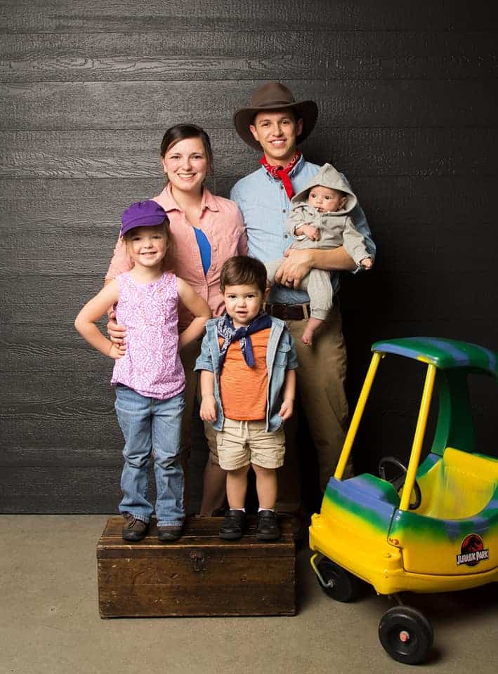 image shows a family dressed as jurassic world characters