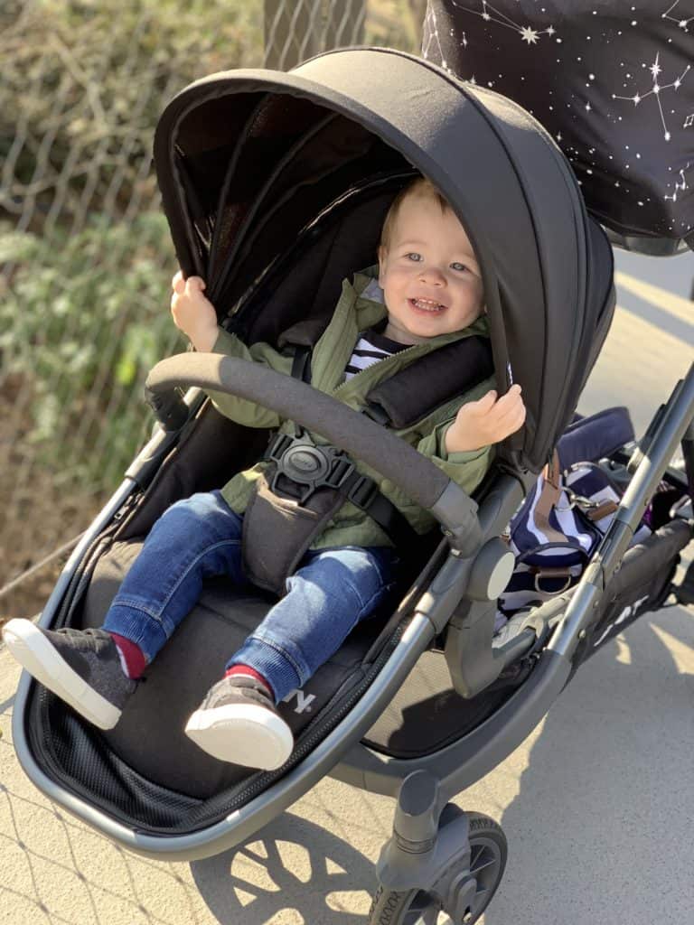 Child in Joovy Qool Seat with Adapters