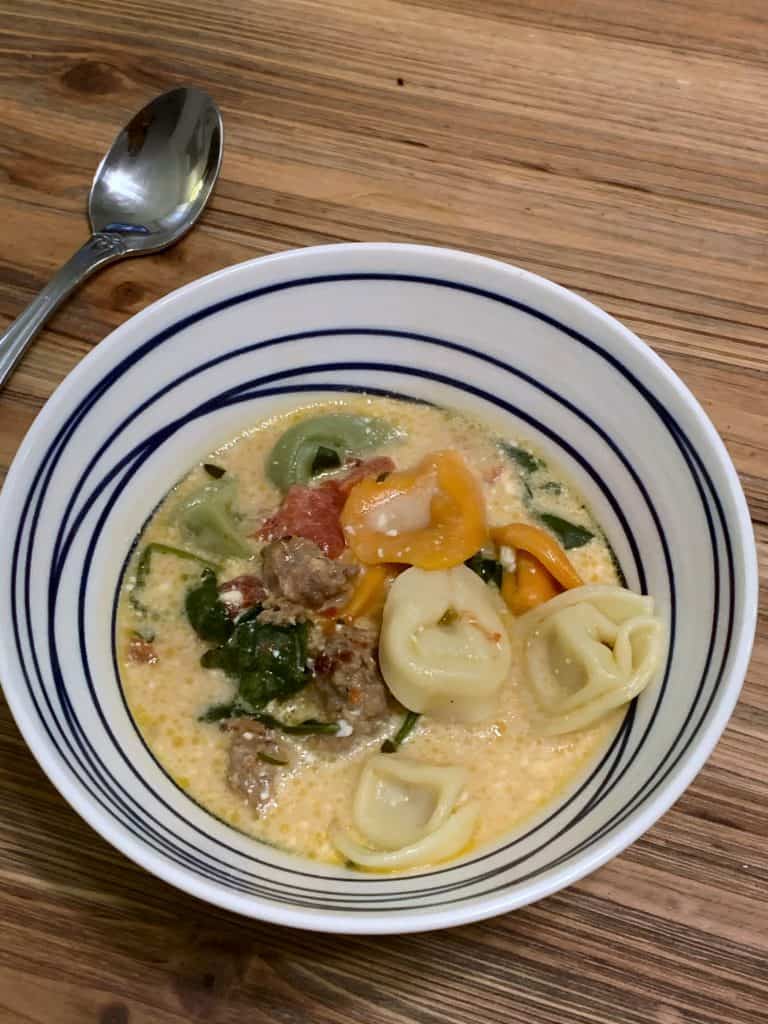 bowl of slow cooker sausage and tortellini soup