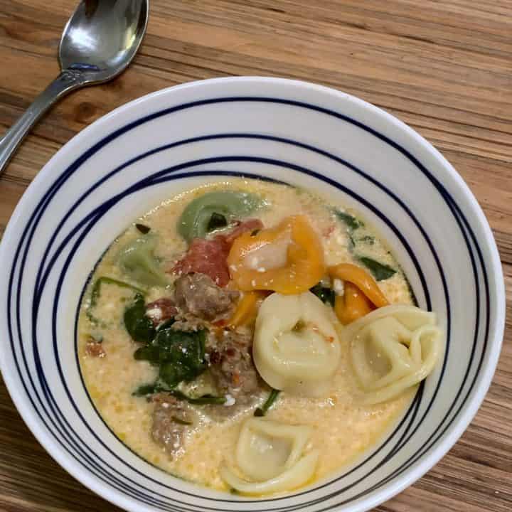 bowl of slow cooker sausage and tortellini soup