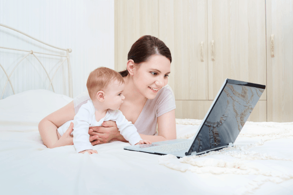 baby and mom at computer