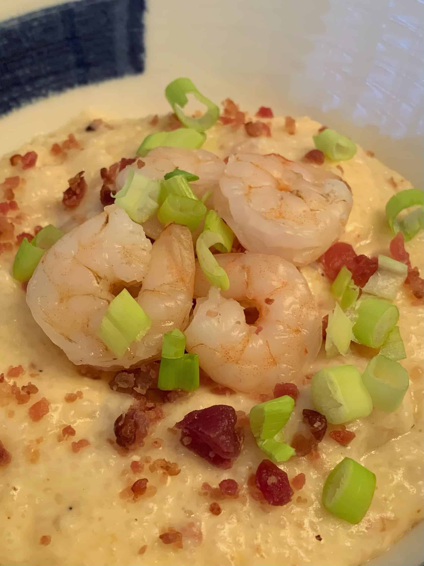 shows a bowl of shrimp and grits