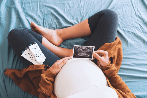 pregnant mom with an ultrasound photo