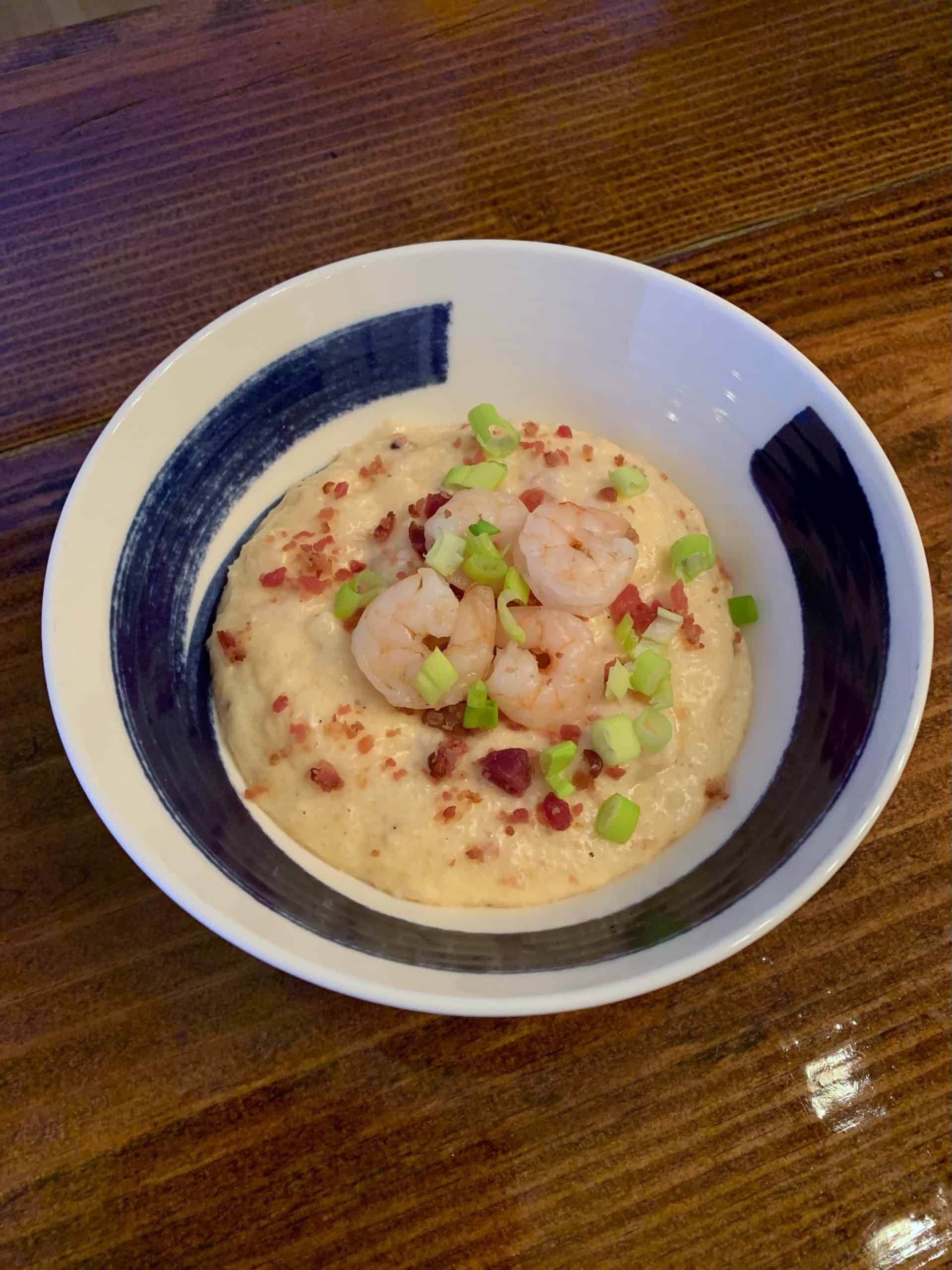 shows a bowl of shrimp and grits