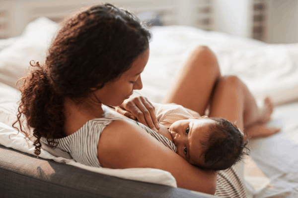 image shows a woman breastfeeding