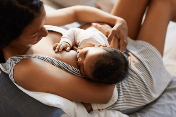 image shows a woman breastfeeding