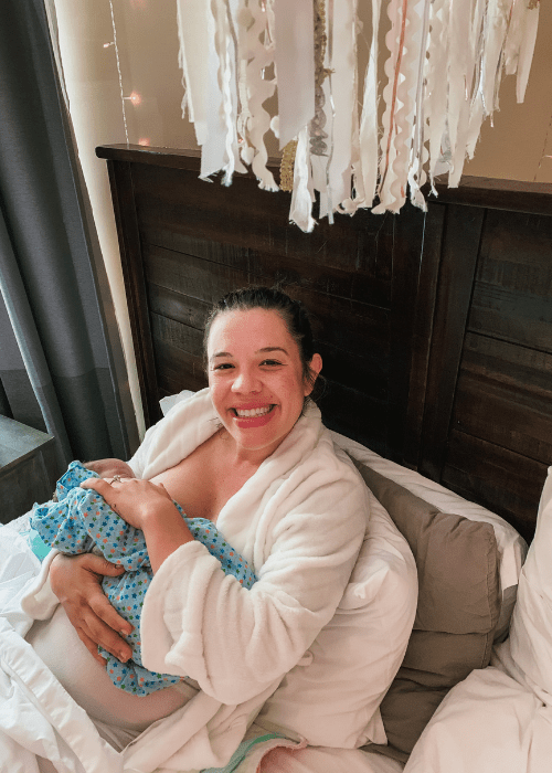 a mother breastfeeding her newborn baby