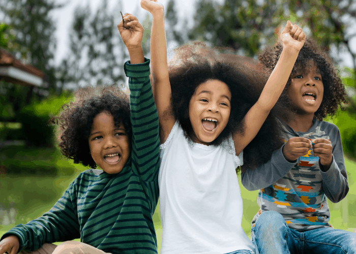 image shows kids cheering