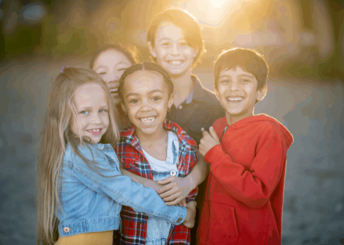 a group of children hugging