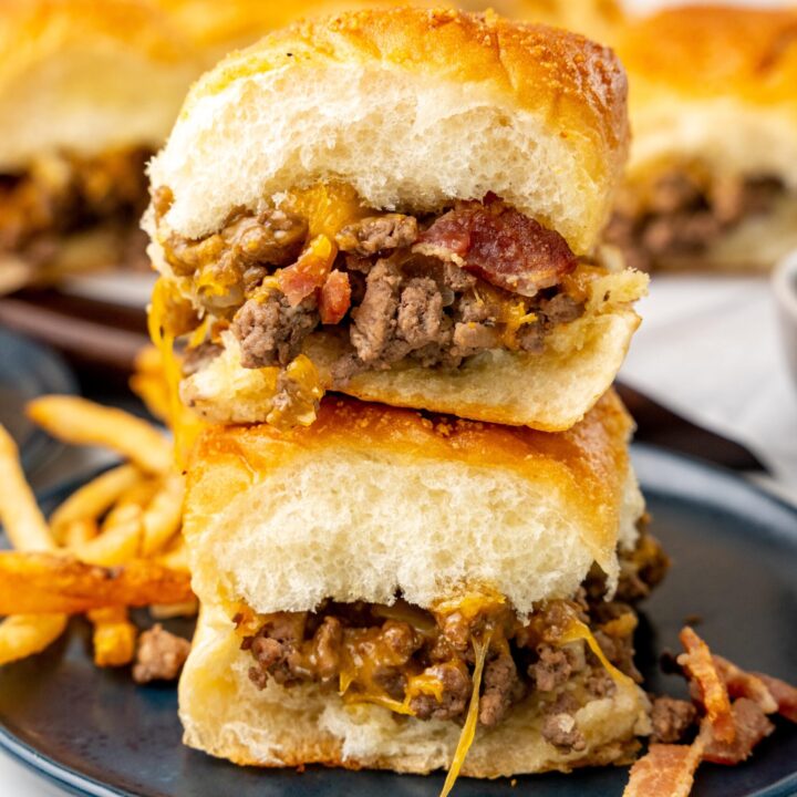 two bacon cheeseburger sliders stacked