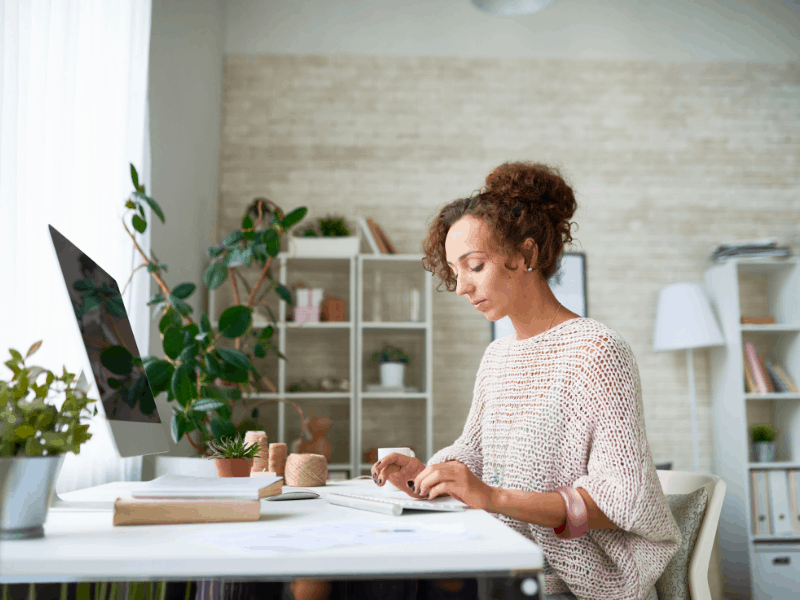 woman working on computer at her desk