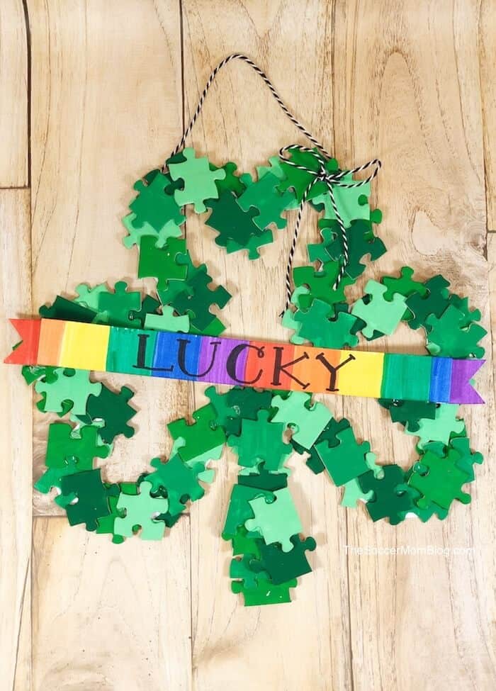 image shows a wreath made from puzzle pieces