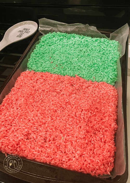 image shows a baking sheet with red and green dyed rice