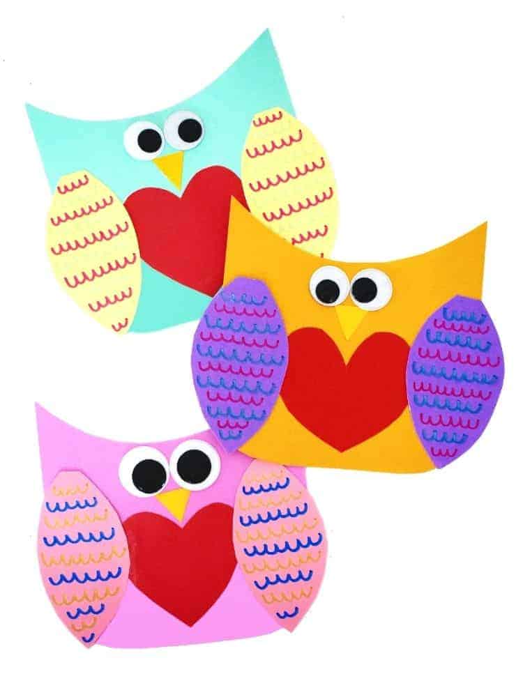 image shows three owls made from paper