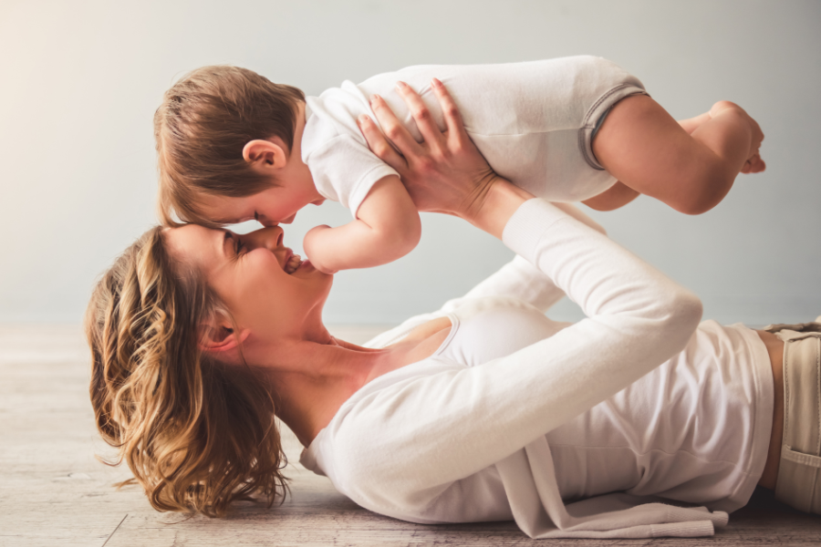 woman kissing baby