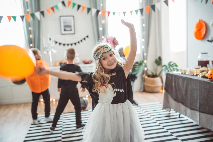 little girl dancing at halloween party