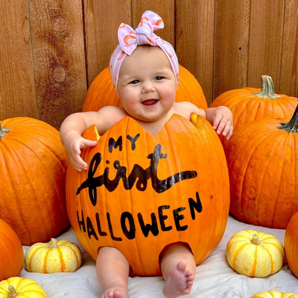 baby in a big pumpkin