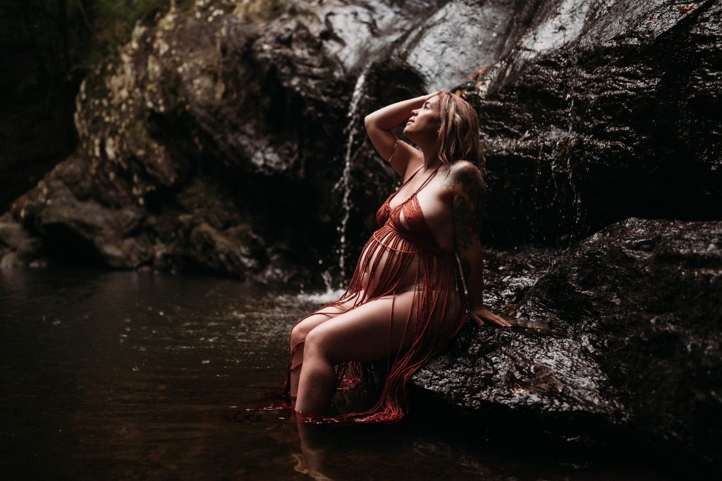 pregnant woman sitting in water