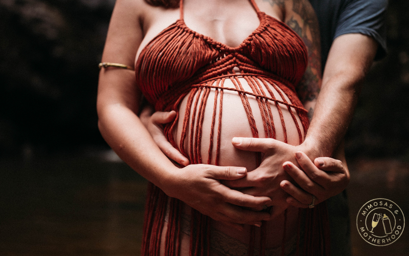 hands on pregnant belly wearing macrame dress