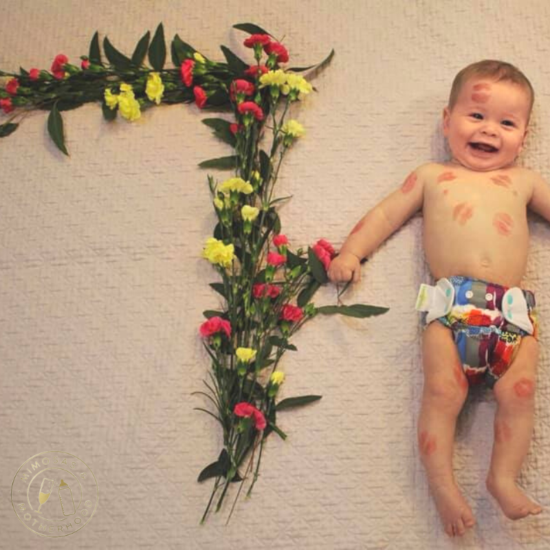 baby with floral number