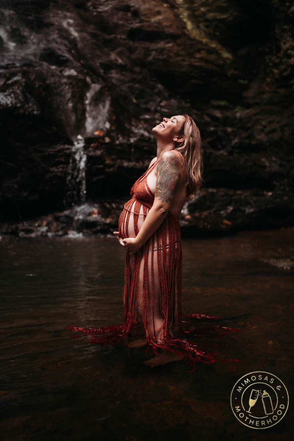 pregnant woman standing in water