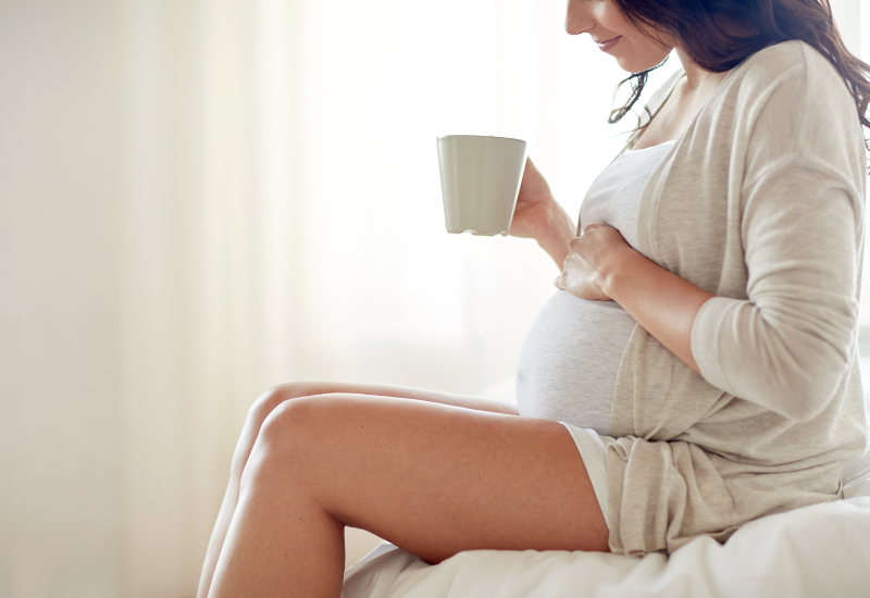 pregnant woman drinking tea