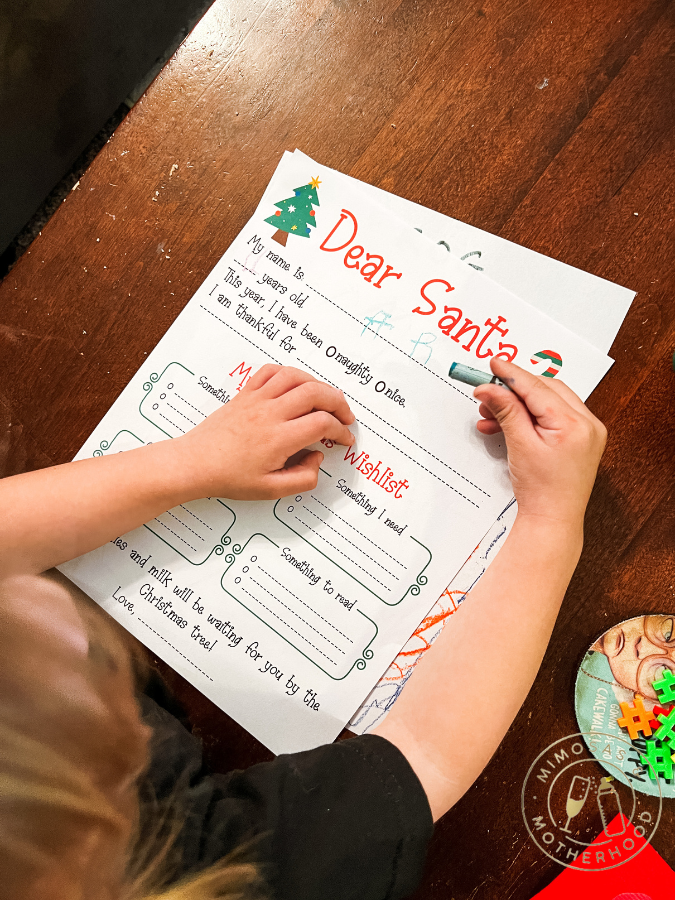 child filling out printable letter to santa