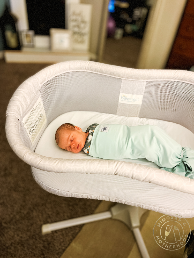 baby in bedside sleeper