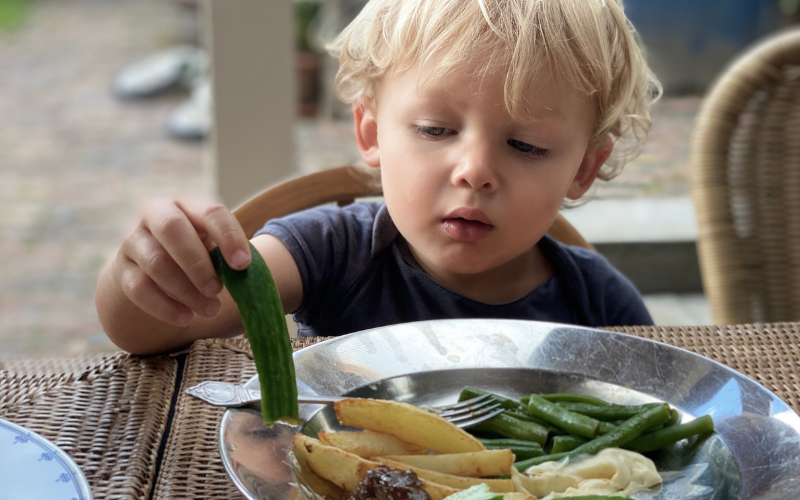 boy eating green foods