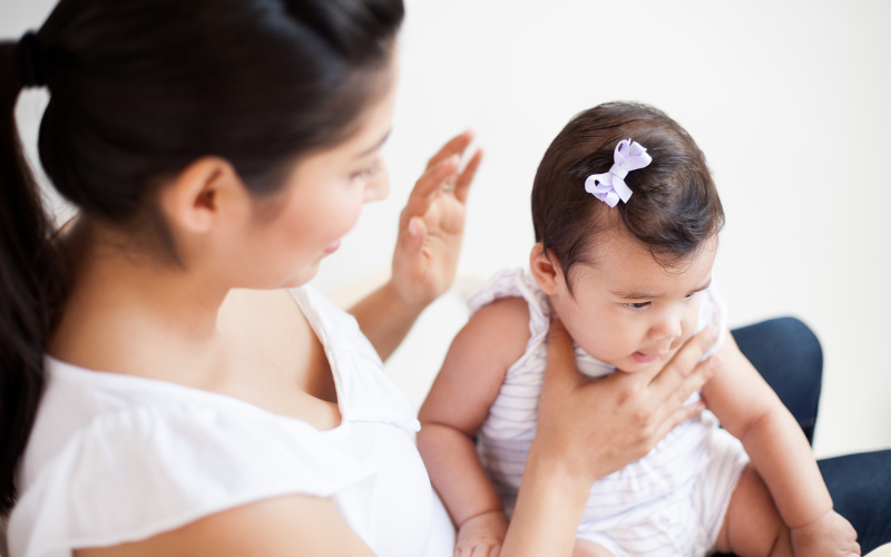 woman burping baby