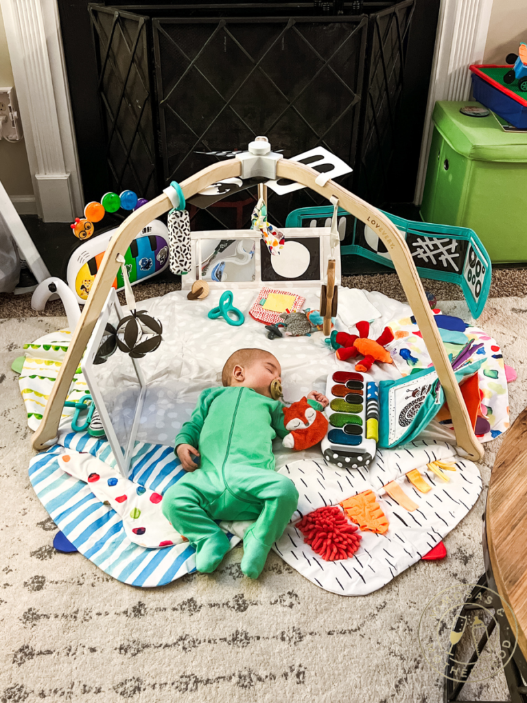 baby on lovevery play gym mat