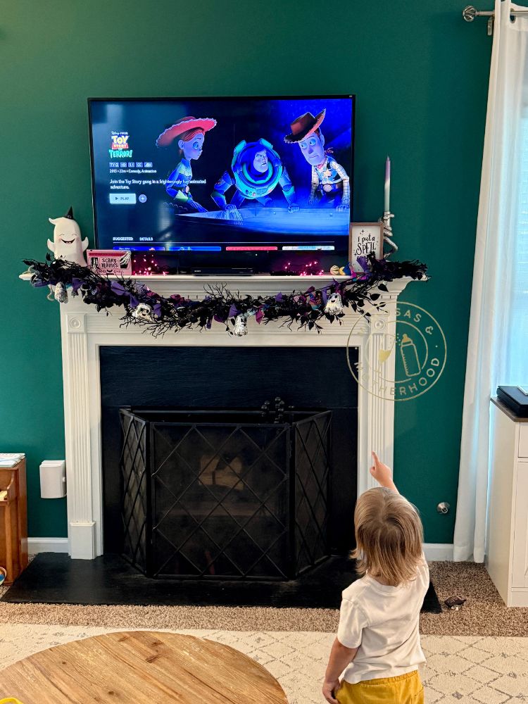 image shows a child watching a g-rated Halloween movie