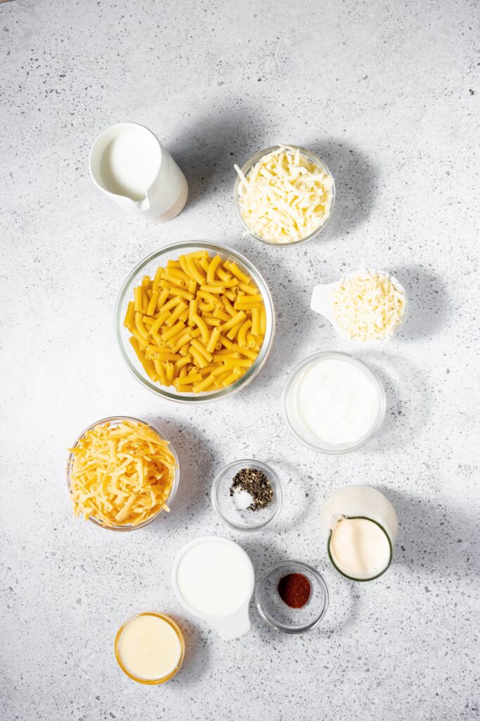 image shows the ingredients needed to make crockpot mac and cheese