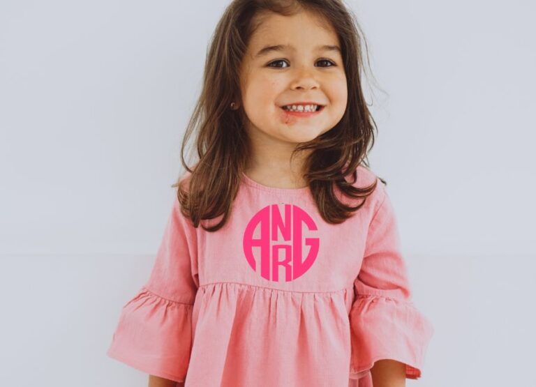 image show a child wearing a monogrammed top with 4 initials