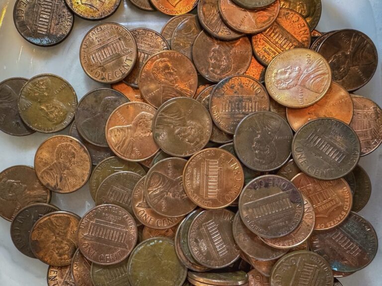 image shows a pile of dirty pennies
