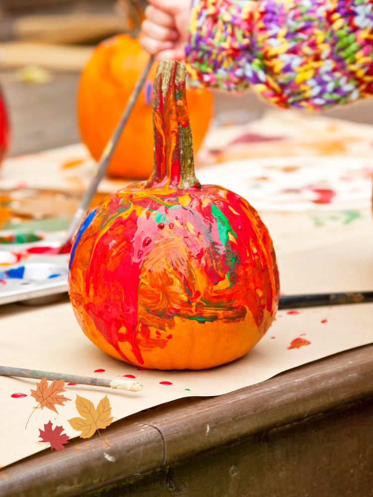 image shows painted pumpkins outside