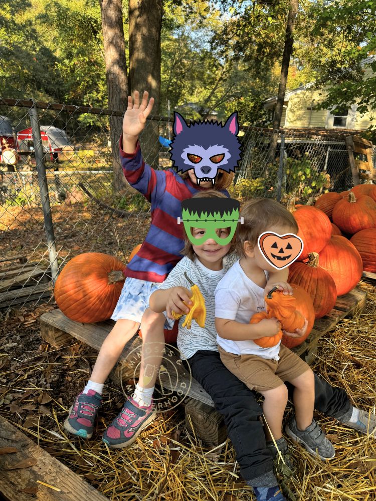 image shows kids outside with Halloween pumpkins