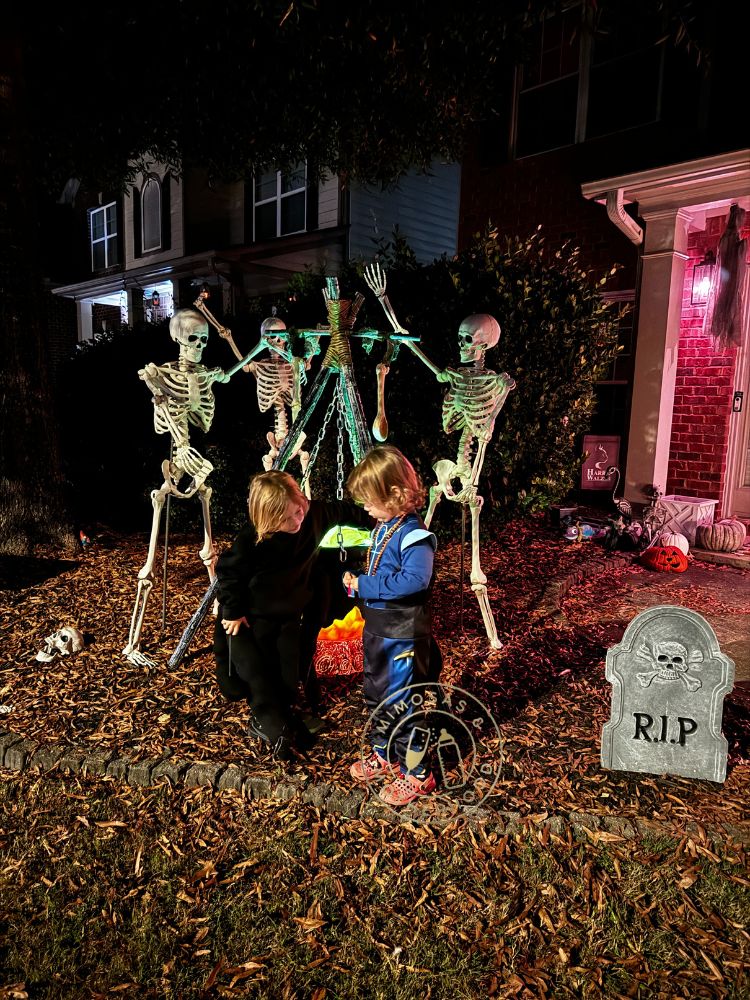 image shows kids outside doing a Halloween scavenger hunt