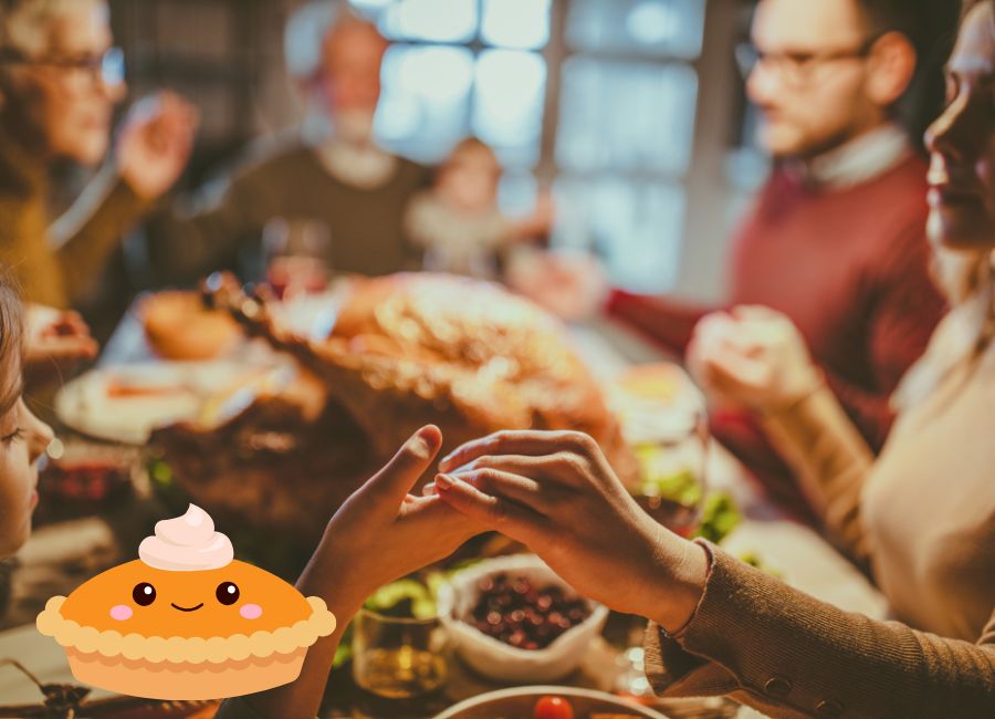 family holding hands during Thanksgiving dinner