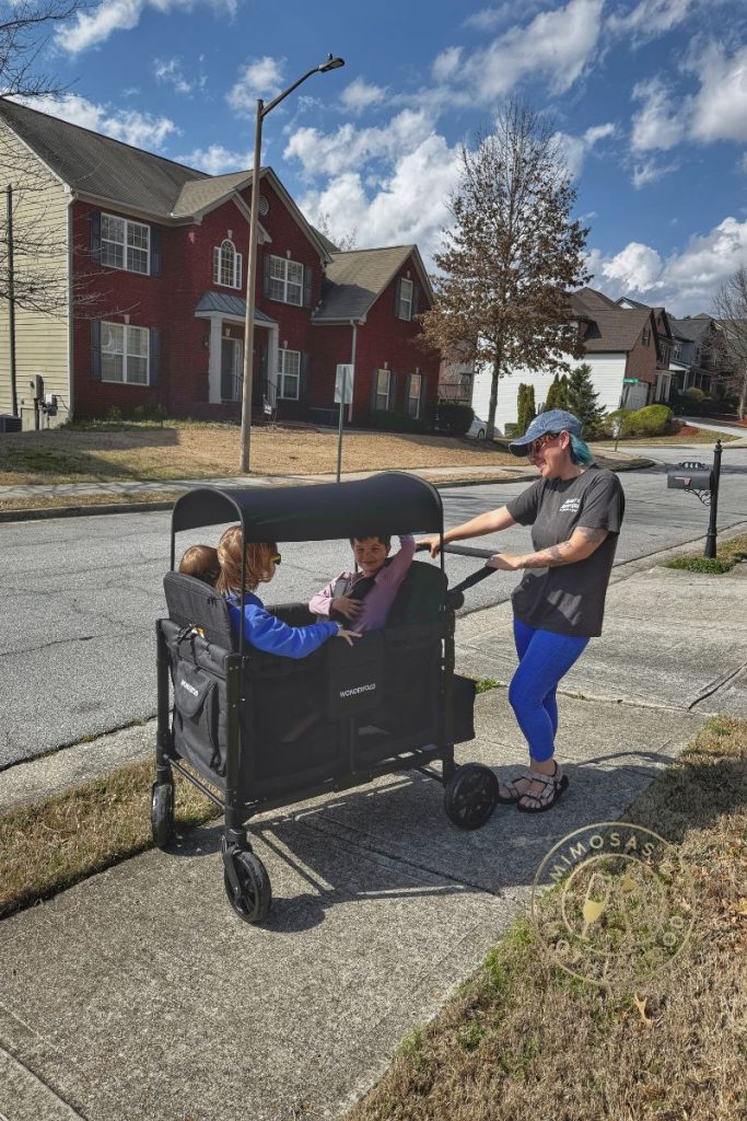 woman with three children in Wonderfold W4 wagon
