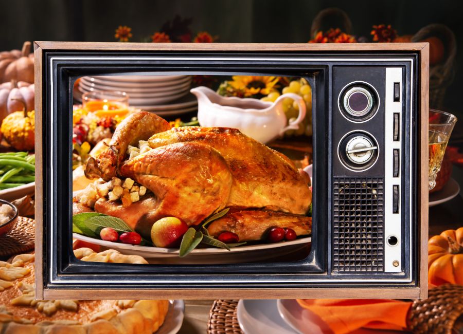 image shows a tv showing a thanksgiving dinner