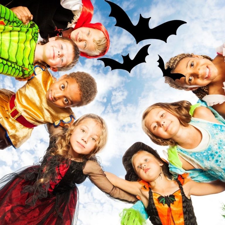 children in a circle wearing halloween costumes