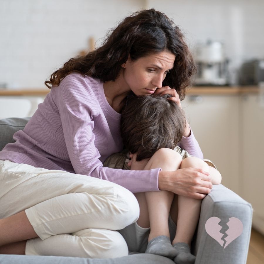 image shows an adult comforting a child