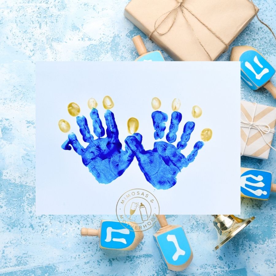 image shows handprint craft on a Hanukkah background.