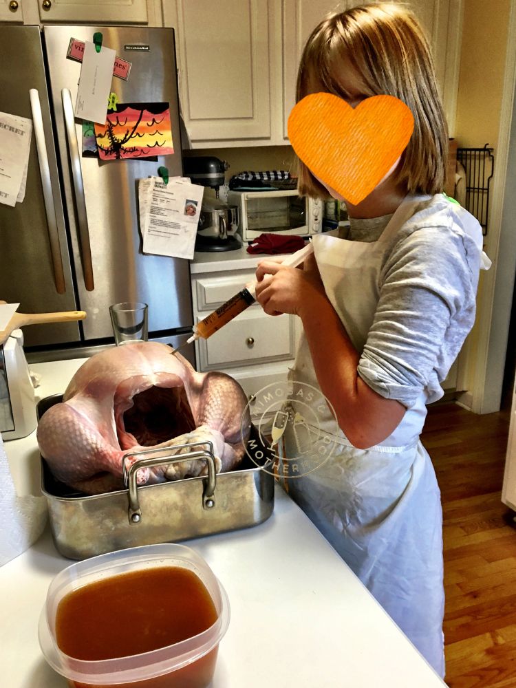 image shows a child making a thanksgiving turkey
