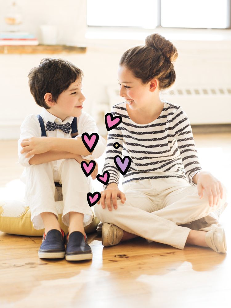 kids smiling with purple and pink hearts