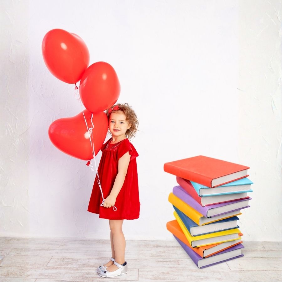 little girl with valentines day balloons and books